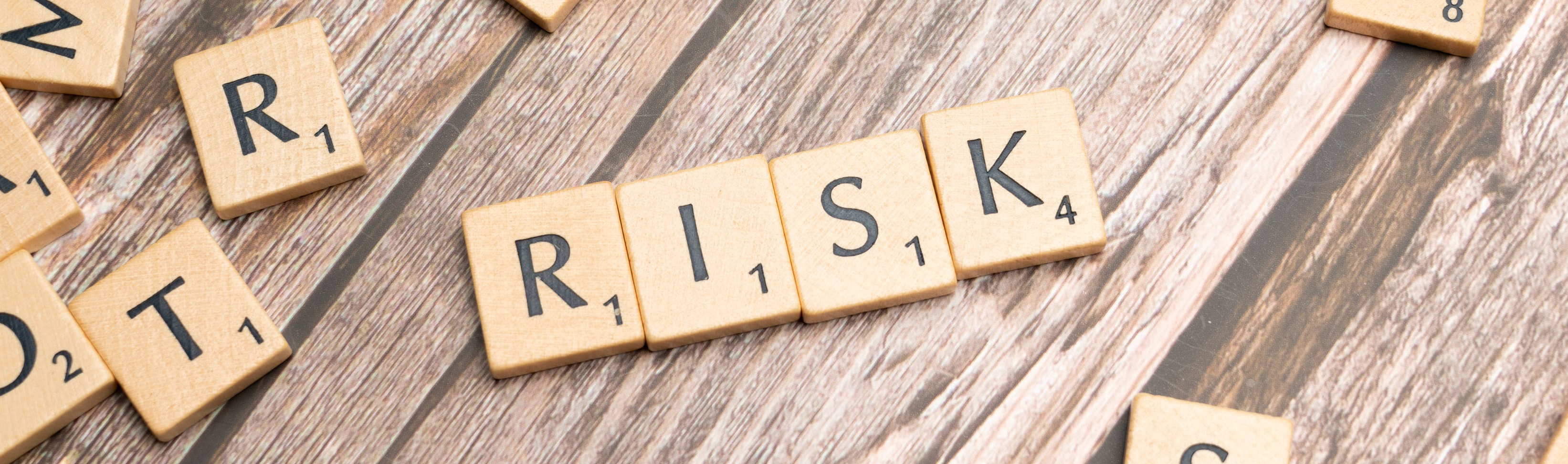 Scrabble tiles spelling out the word Risk